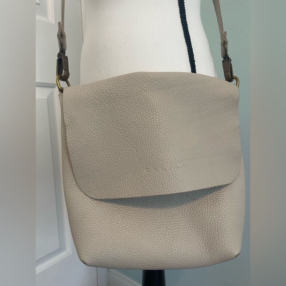 Calma white leather crossbody bag.